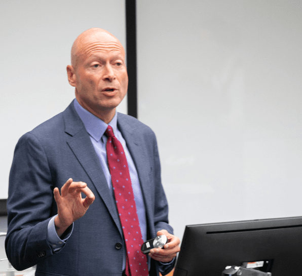 Mitch speaking in a classroom at the University of Minnesota